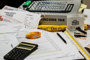 A desk with tax forms on it