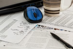 Computer mouse on top of tax files